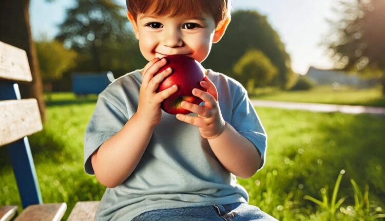 The boy eating an apple